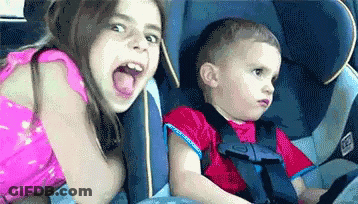 Boy And Girl Sitting In Car Seat GIF