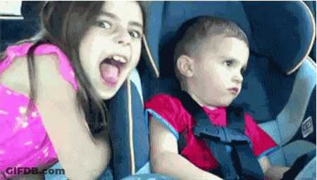 Boy And Girl Sitting In Car Seat GIF