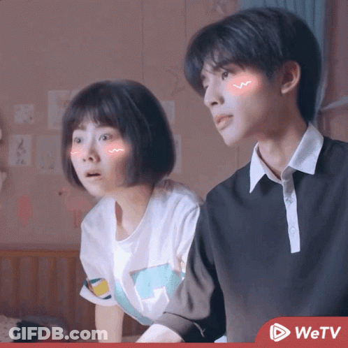 Boy And Girl Sitting Next To Each Other With WETV Logo GIF