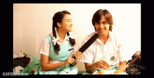 Boy And Girl Sitting With Microphone GIF