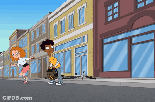 Boy And Girl Standing By Building With Letter I GIF