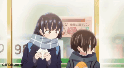 Boy And Girl Standing In Front Of 99 Sign GIF