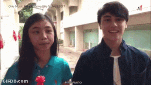 Boy And Girl Standing Together Girl In Blue Ralph Lauren Shirt GIF
