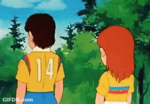 Boy And Girl Standing Together In Woods GIF