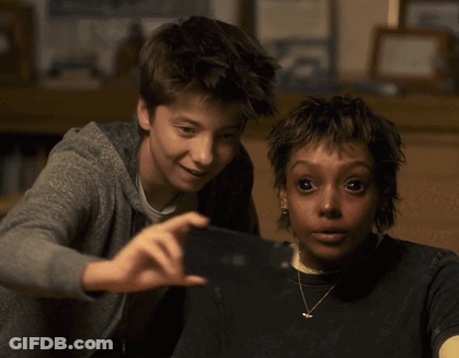 Boy And Girl Taking Selfie GIF