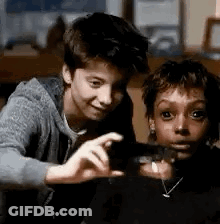 Boy And Girl Taking Selfie With Camera GIF
