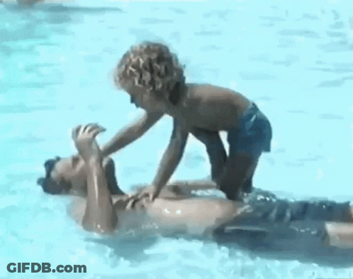 Boy And Man Playing In Pool GIF