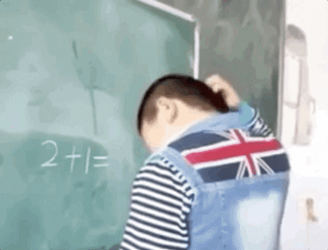 Boy Calculating And Confused While Facing The Board GIF