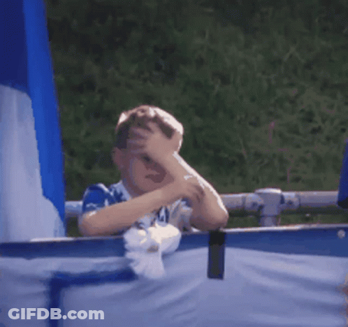 Boy Covering Face In Blue And White Shirt Number 44 GIF