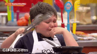 Boy Crying Holding Tongs GIF