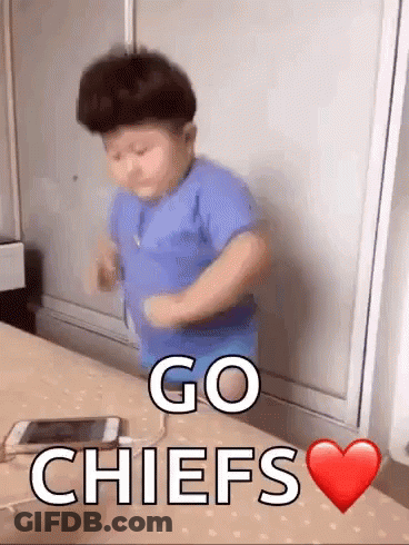 Boy Dancing In Front Of Go Chiefs Table GIF