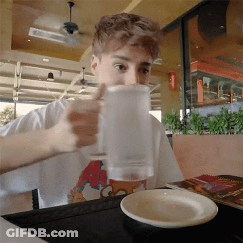 Boy Drinking Water Slowly On Glass GIF