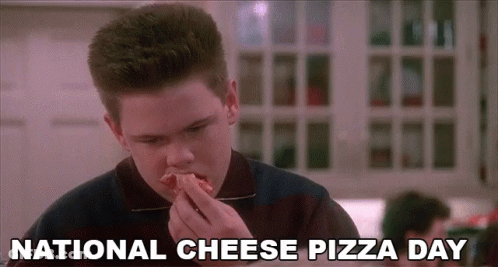 Boy Eating Pizza In Restaurant GIF