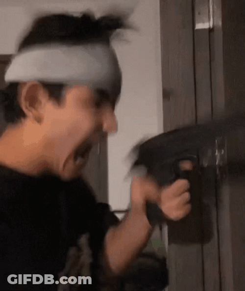 Boy Holding A Machine Gun GIF