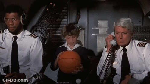 Boy Holding Basketball Talks On Phone GIF