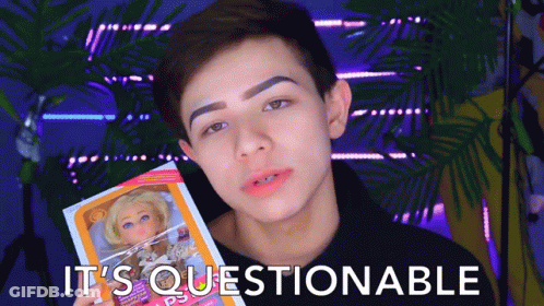 Boy Holding Doll Saying It's Questionable GIF