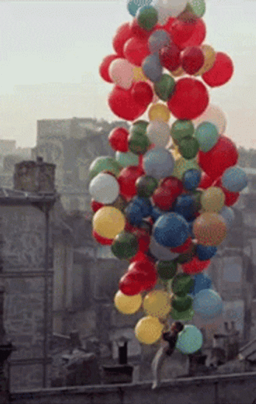 Boy Holding Floating Balloon GIF