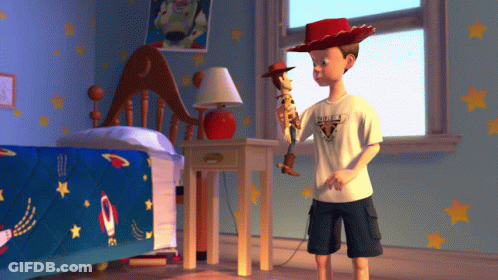 Boy Holding Woody Doll In Bedroom With Stars GIF
