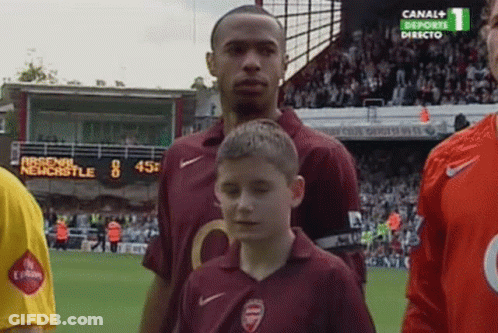 Boy In Arsenal Shirt In Front Of Soccer Player GIF