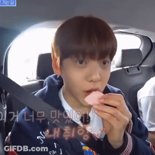 Boy In Back Seat Eating Strawberry GIF