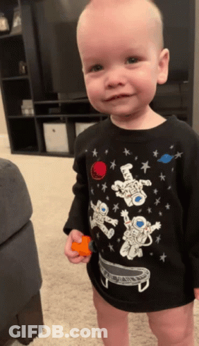 Boy In Black Astronaut Shirt GIF