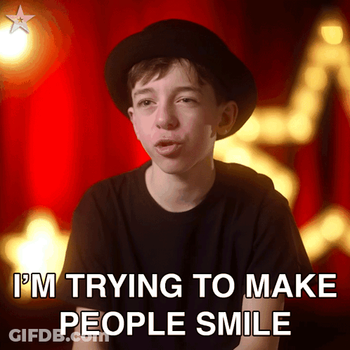 Boy In Black Hat And Shirt Smiling GIF