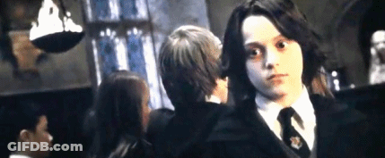 Boy In Black Suit And Tie With Another Boy GIF