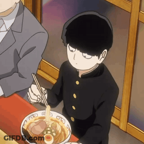 Boy In Black Uniform Eating Ramen With Chopsticks While Man Sits Behind GIF