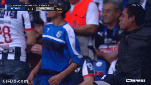 Boy In Blue And White Jersey In Soccer Stands GIF