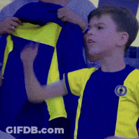 Boy In Blue And Yellow Shirt With Letter O GIF