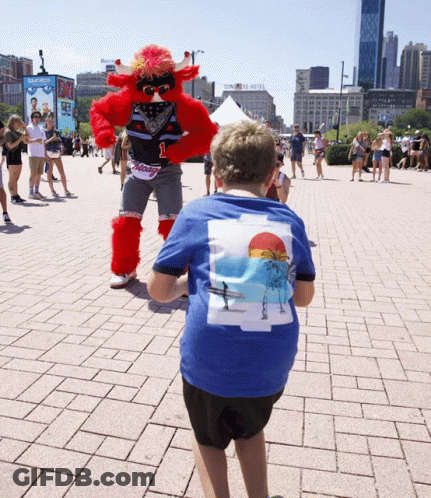 Boy In Blue Beach Shirt With Mascot GIF