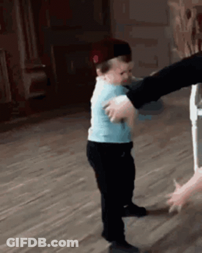 Boy In Blue Dancing With Woman In Black Hat GIF