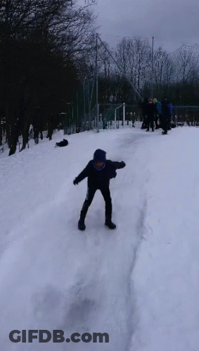 Boy In Blue Jacket Standing In Snow GIF