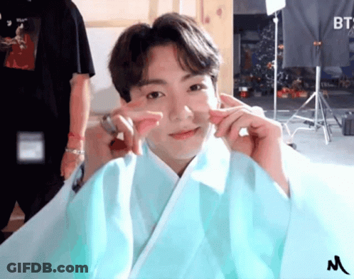 Boy In Blue Kimono Making Peace Sign GIF