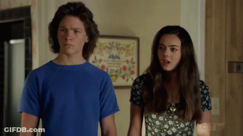 Boy In Blue Shirt And Girl In Black And White Dress GIF