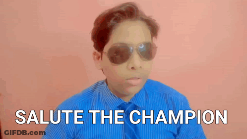 Boy In Blue Shirt And Sunglasses Says Salute The Champion GIF