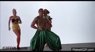 Boy In Blue Shirt And White Shorts Jumping GIF