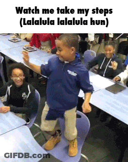 Boy In Blue Shirt Dancing In Classroom GIF