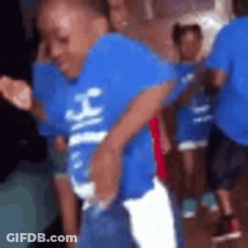 Boy In Blue Shirt Dancing With Group GIF