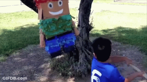 Boy In Blue Shirt Number 69 Next To Cardboard Man GIF