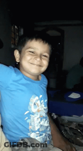 Boy In Blue Shirt Smiling GIF