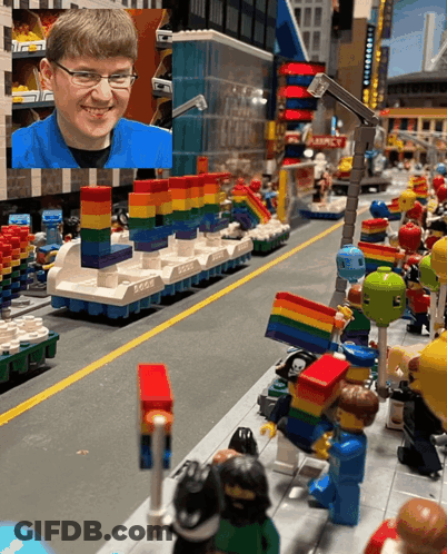Boy In Blue Shirt Smiling In Lego City GIF