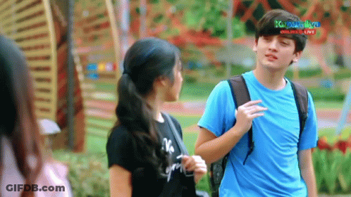 Boy In Blue Shirt Talking To Girl In Black Shirt Saying No GIF
