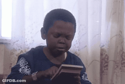 Boy In Blue Shirt With Palm Trees Holding Book GIF