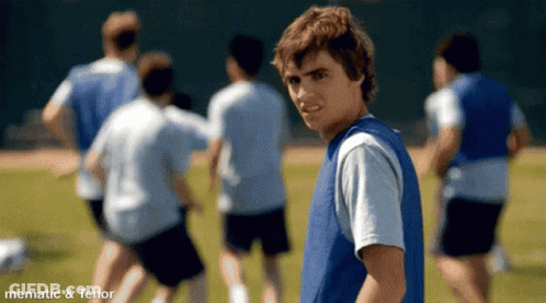 Boy In Blue Vest With Soccer Team GIF