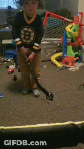 Boy In Boston Bruins Jersey Playing Hockey GIF
