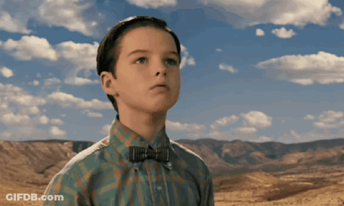 Boy In Bow Tie And Plaid Shirt Looking Up GIF
