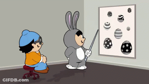 Boy In Bunny Costume Pointing At Eggs GIF
