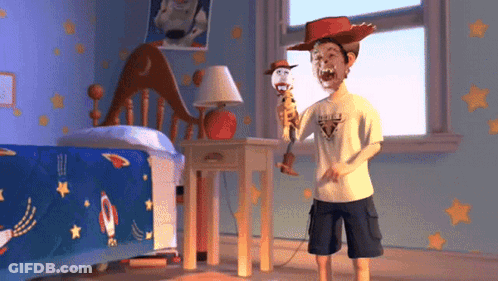 Boy In Cowboy Hat Holding Woody Doll GIF