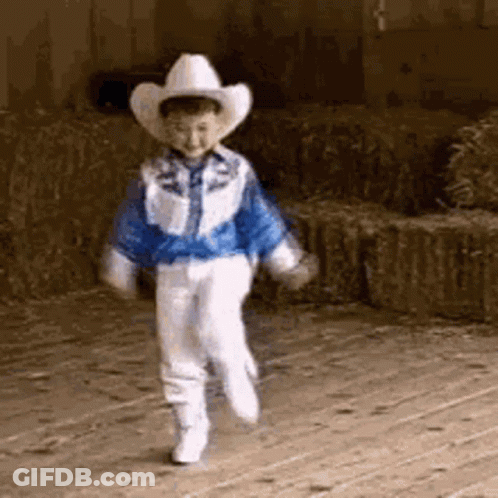 Boy In Cowboy Hat Walking On Wooden Floor GIF